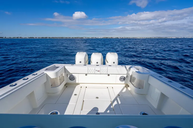  Yacht Photos Pics 2017 SeaVee 370Z boat on open ocean, featuring triple outboard engines.