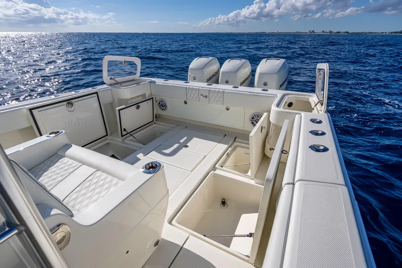  Yacht Photos Pics 2017 SeaVee 370Z boat deck with seating and storage, overlooking the ocean.