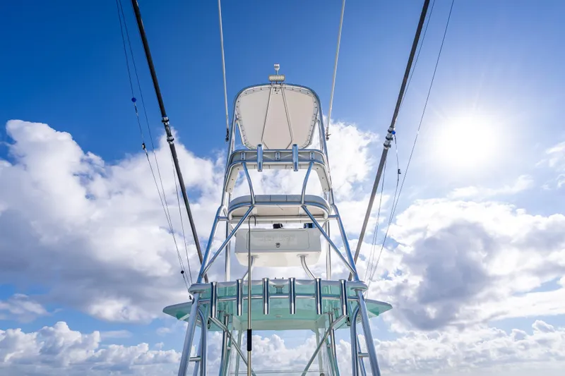  Yacht Photos Pics 2017 SeaVee 370Z boat tower against a bright blue sky with clouds.
