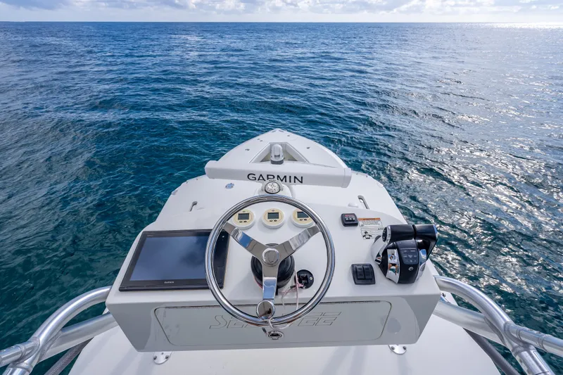  Yacht Photos Pics Helm of 2017 SeaVee 370Z boat with Garmin navigation, overlooking open ocean.