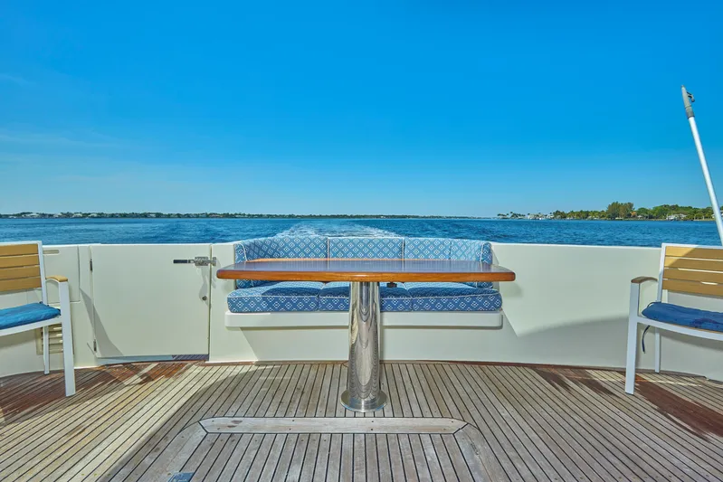  Yacht Photos Pics 2003 McKinna 58 Pilothouse yacht deck with seating and ocean view.