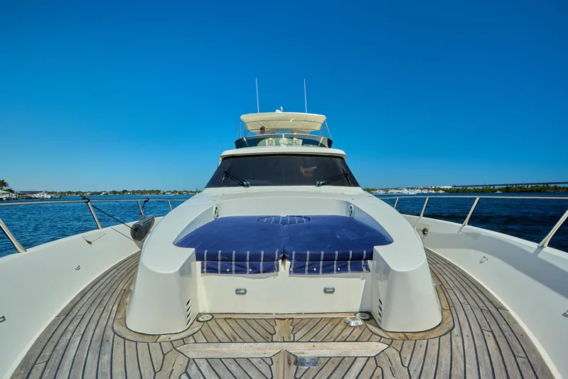  Yacht Photos Pics 2003 McKinna 58 Pilothouse yacht on open water, showcasing sleek design and spacious deck.