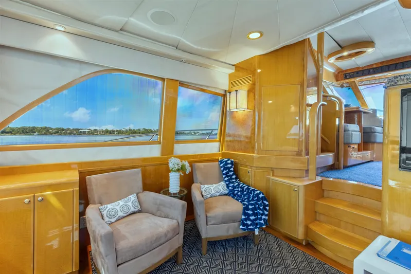  Yacht Photos Pics Luxurious interior of 2003 McKinna 58 Pilothouse yacht with plush seating and scenic windows.