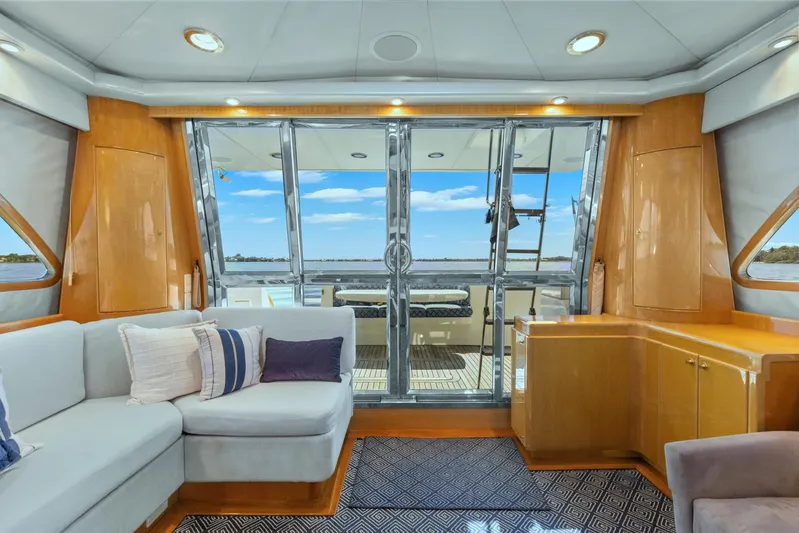  Yacht Photos Pics Luxurious interior of 2003 McKinna 58 Pilothouse yacht with plush seating and ocean view.