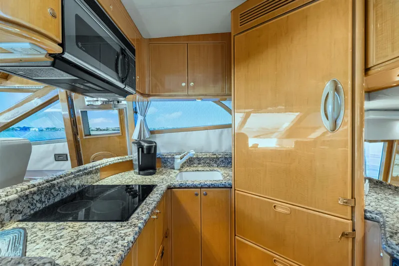  Yacht Photos Pics Luxurious kitchen interior of 2003 McKinna 58 Pilothouse yacht with granite countertops.