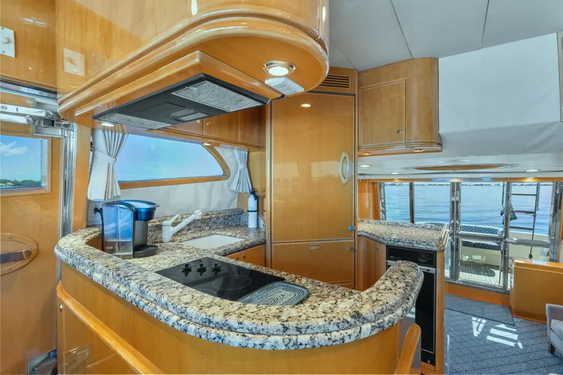  Yacht Photos Pics Luxurious 2003 McKinna 58 Pilothouse yacht interior with modern kitchen and ocean view.