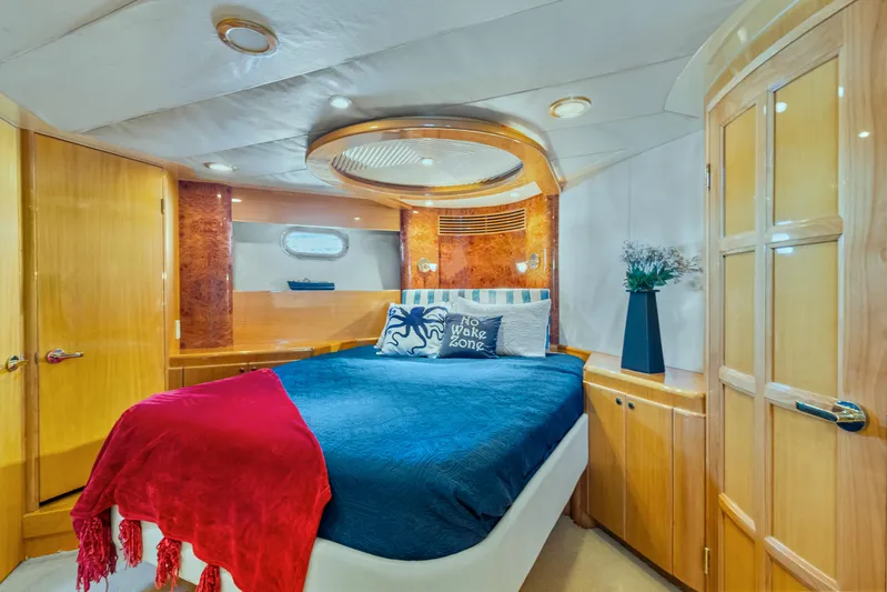  Yacht Photos Pics Luxurious cabin interior of 2003 McKinna 58 Pilothouse yacht with elegant wood finishes.