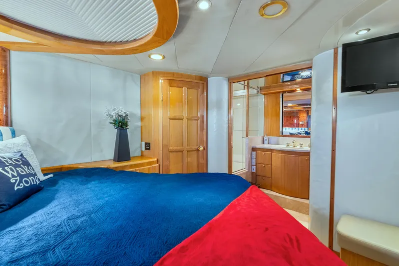  Yacht Photos Pics Luxurious cabin interior of 2003 McKinna 58 Pilothouse yacht with cozy bedding and ensuite bathroom.