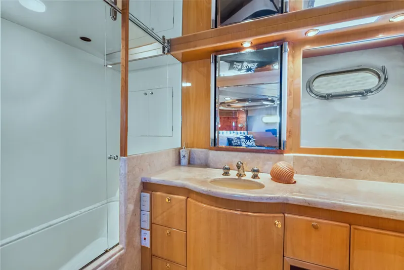  Yacht Photos Pics Luxurious bathroom in 2003 McKinna 58 Pilothouse yacht with elegant wood cabinetry.