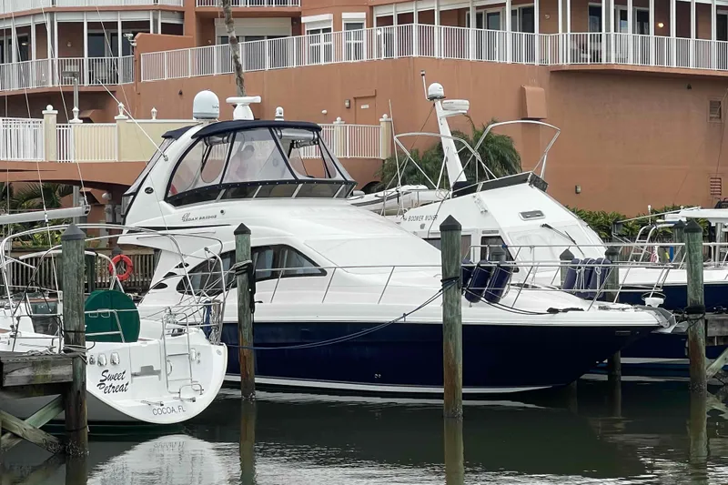 Beira Mar Yacht Photos Pics 2005 Sea Ray 420 Sedan Bridge yacht docked at marina, surrounded by other boats.