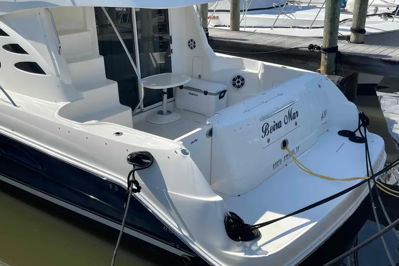 Beira Mar Yacht Photos Pics 2005 Sea Ray 420 Sedan Bridge yacht docked, featuring spacious deck and elegant design.