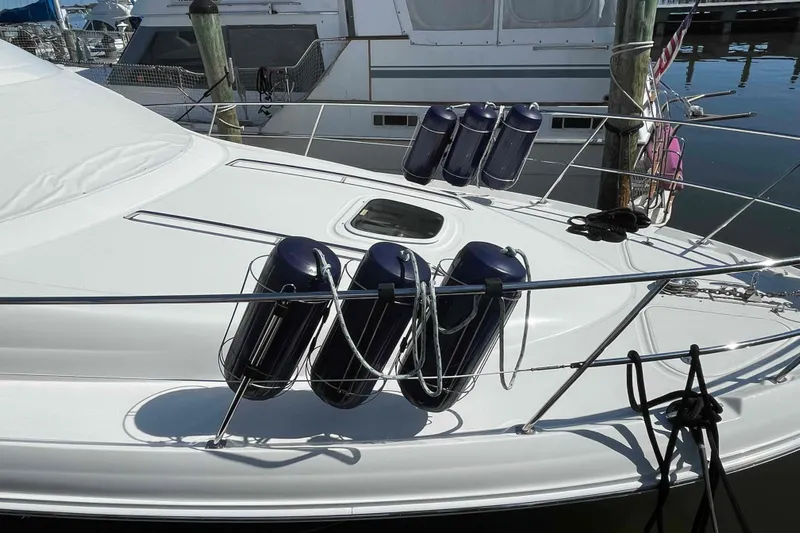Beira Mar Yacht Photos Pics 2005 Sea Ray 420 Sedan Bridge yacht with fenders docked at marina.