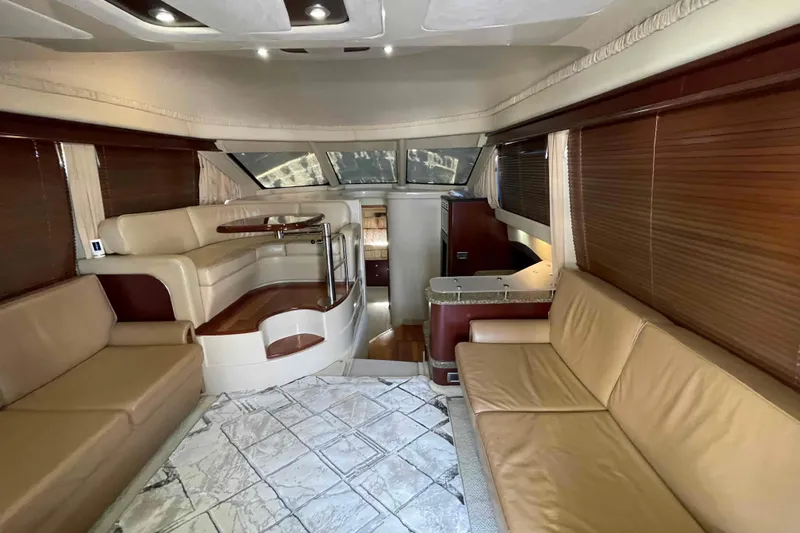 Beira Mar Yacht Photos Pics Luxurious interior of 2005 Sea Ray 420 Sedan Bridge yacht with elegant seating and modern design.