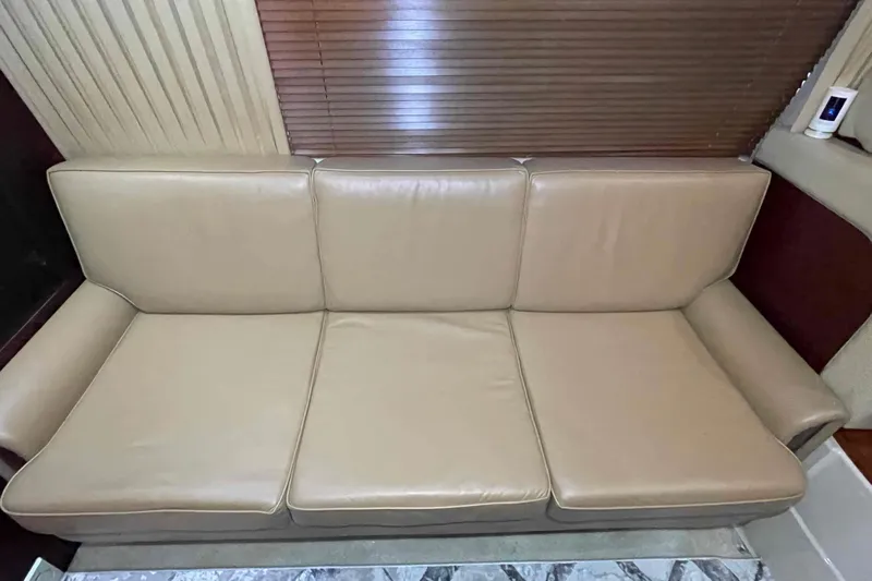 Beira Mar Yacht Photos Pics Beige leather sofa in 2005 Sea Ray 420 Sedan Bridge yacht interior.