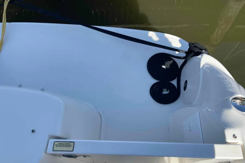 Beira Mar Yacht Photos Pics Deck view of a 2005 Sea Ray 420 Sedan Bridge with coiled ropes and water reflection.