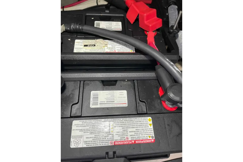 Beira Mar Yacht Photos Pics Battery compartment of a 2005 Sea Ray 420 Sedan Bridge with visible cables and labels.