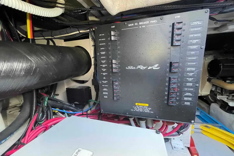 Beira Mar Yacht Photos Pics Electrical panel of a 2005 Sea Ray 420 Sedan Bridge boat, featuring wiring and components.