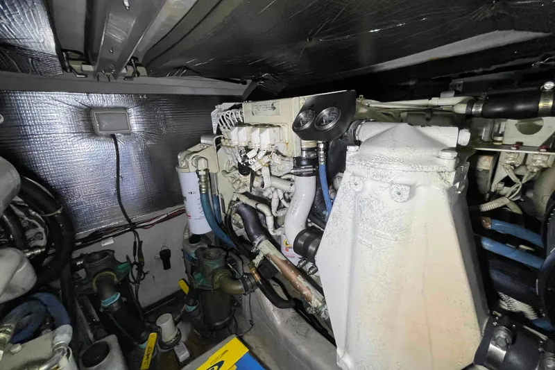 Beira Mar Yacht Photos Pics Engine room of a 2005 Sea Ray 420 Sedan Bridge, showcasing mechanical components.