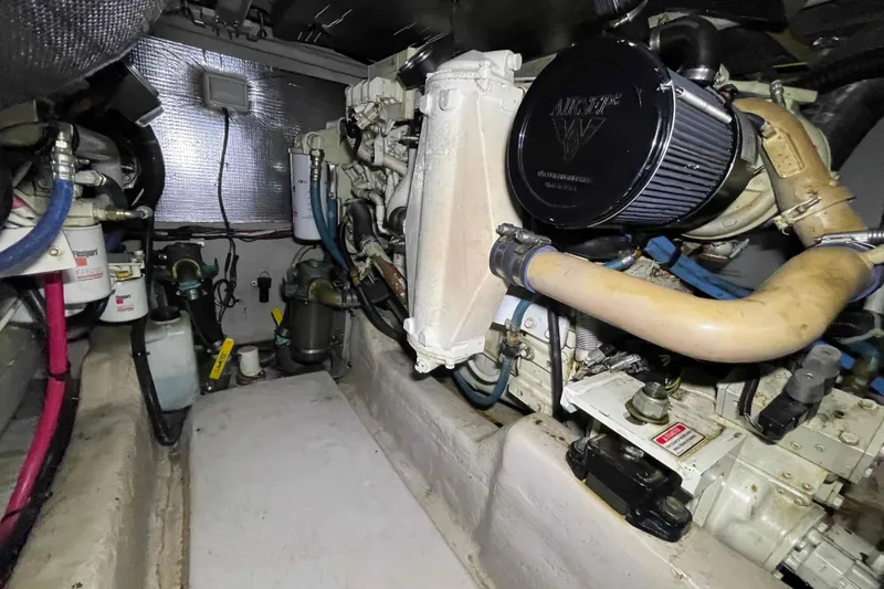 Beira Mar Yacht Photos Pics Engine room of 2005 Sea Ray 420 Sedan Bridge, showcasing mechanical components and filters.