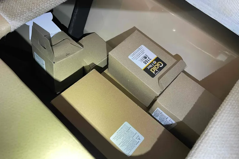 Beira Mar Yacht Photos Pics Boxes stored in a compartment of a 2005 Sea Ray 420 Sedan Bridge.