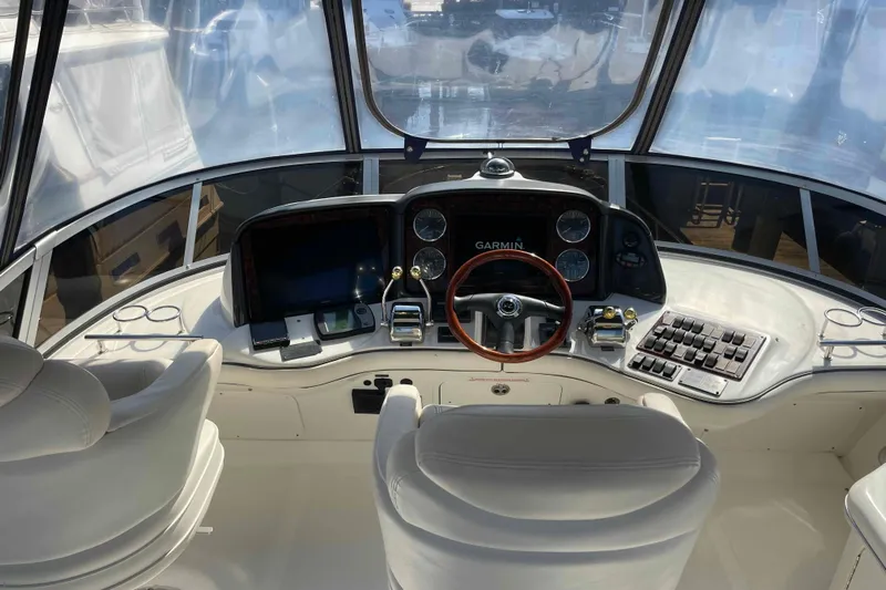 Beira Mar Yacht Photos Pics 2005 Sea Ray 420 Sedan Bridge helm with Garmin navigation and luxurious seating.