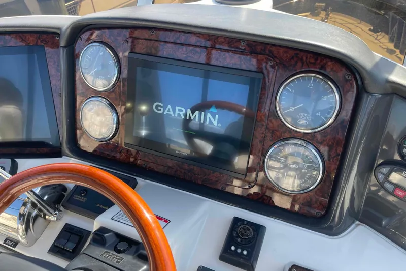 Beira Mar Yacht Photos Pics Dashboard of 2005 Sea Ray 420 Sedan Bridge with Garmin display and gauges.