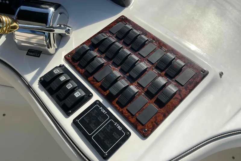 Beira Mar Yacht Photos Pics Control panel of a 2005 Sea Ray 420 Sedan Bridge boat with switches and throttle.