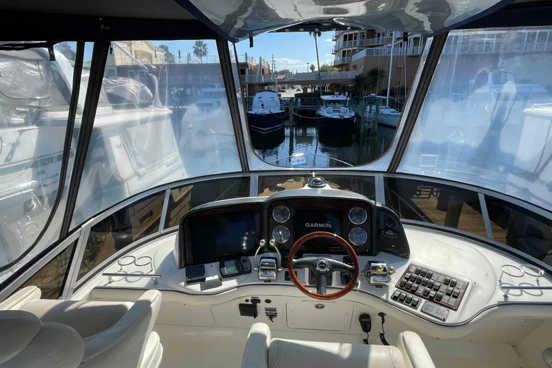 Beira Mar Yacht Photos Pics Interior view of 2005 Sea Ray 420 Sedan Bridge helm with Garmin navigation system.