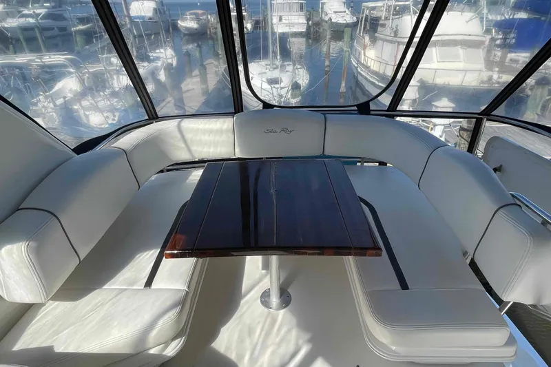 Beira Mar Yacht Photos Pics Luxurious seating area on 2005 Sea Ray 420 Sedan Bridge yacht with marina view.