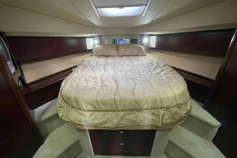 Beira Mar Yacht Photos Pics Luxurious bedroom interior of 2005 Sea Ray 420 Sedan Bridge yacht with cozy bedding.