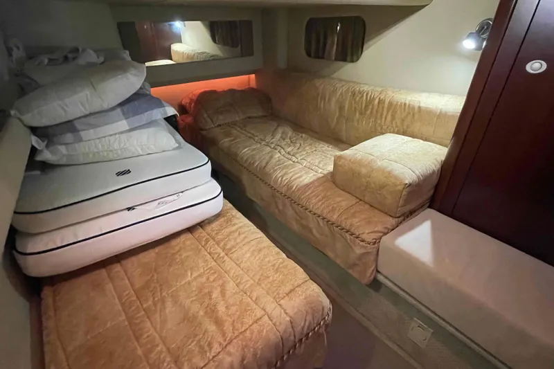 Beira Mar Yacht Photos Pics 2005 Sea Ray 420 Sedan Bridge cabin with cozy bedding and ambient lighting.