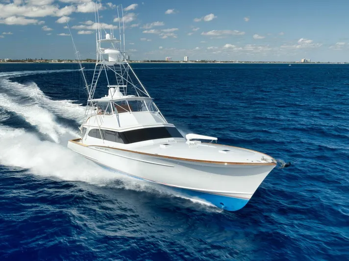 Pescaria Yacht Photos Pics 2009 Rybovich Custom Convertible yacht cruising on open blue ocean.