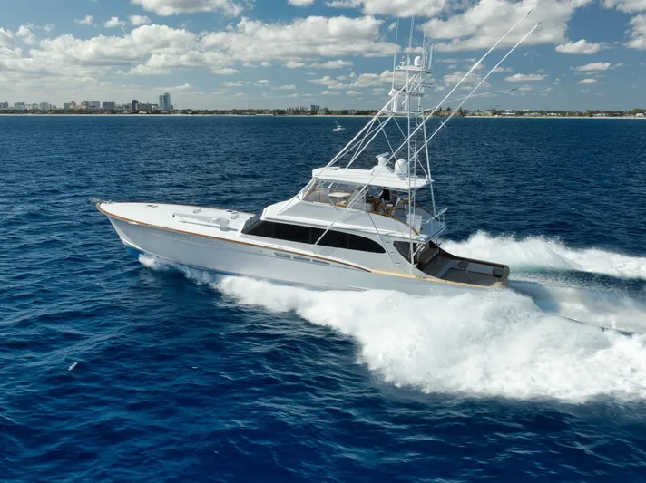 Pescaria Yacht Photos Pics 2009 Rybovich Custom Convertible yacht cruising on open blue ocean.