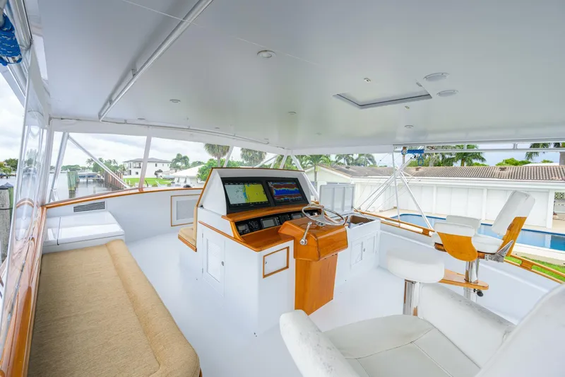 Pescaria Yacht Photos Pics 2009 Rybovich Custom Convertible yacht interior with navigation console and seating area.