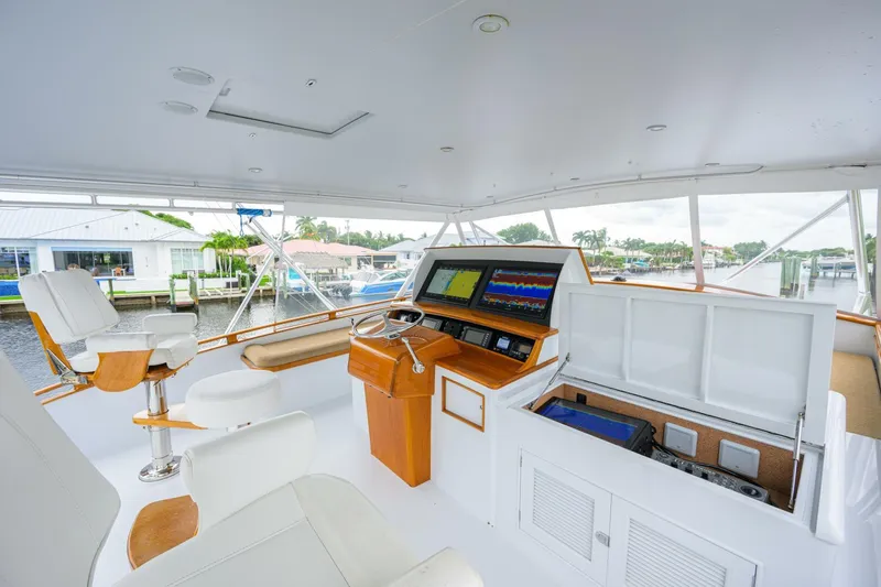 Pescaria Yacht Photos Pics 2009 Rybovich Custom Convertible yacht interior with navigation equipment and seating.