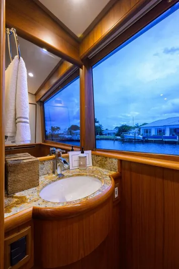Pescaria Yacht Photos Pics Luxurious bathroom in 2009 Rybovich Custom Convertible yacht with scenic window view.