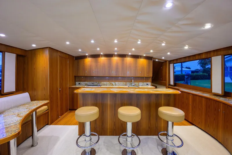 Pescaria Yacht Photos Pics Luxurious 2009 Rybovich Custom Convertible yacht interior with elegant wood finishes and modern lighting.