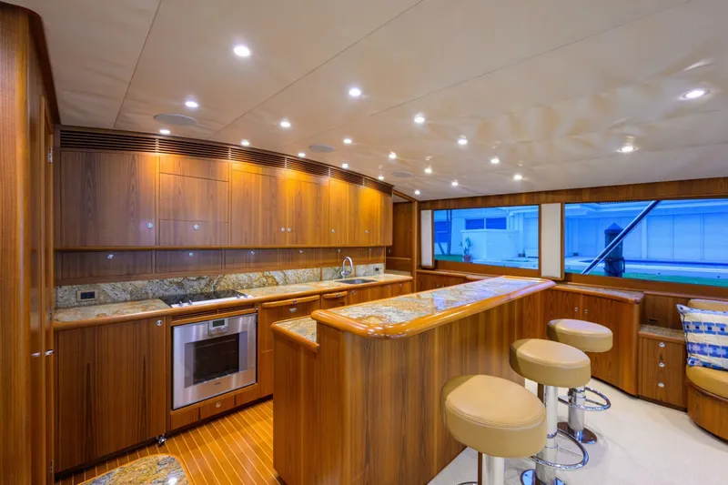 Pescaria Yacht Photos Pics Luxurious 2009 Rybovich Custom Convertible yacht interior with modern kitchen and bar seating.