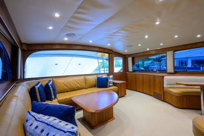Pescaria Yacht Photos Pics Luxurious interior of 2009 Rybovich Custom Convertible yacht with elegant seating and wooden accents.
