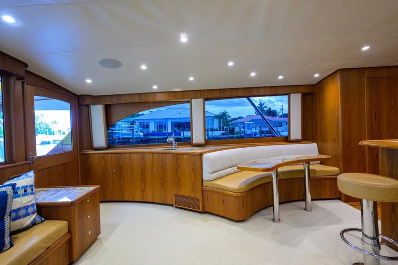 Pescaria Yacht Photos Pics Luxurious interior of 2009 Rybovich Custom Convertible yacht with elegant wood finish and seating.