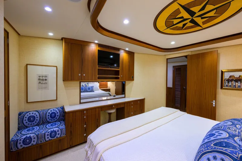 Pescaria Yacht Photos Pics Luxurious 2009 Rybovich Custom Convertible yacht bedroom with elegant wood finishes and nautical decor.