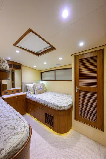 Pescaria Yacht Photos Pics Interior of 2009 Rybovich Custom Convertible yacht with cozy twin beds and wooden accents.