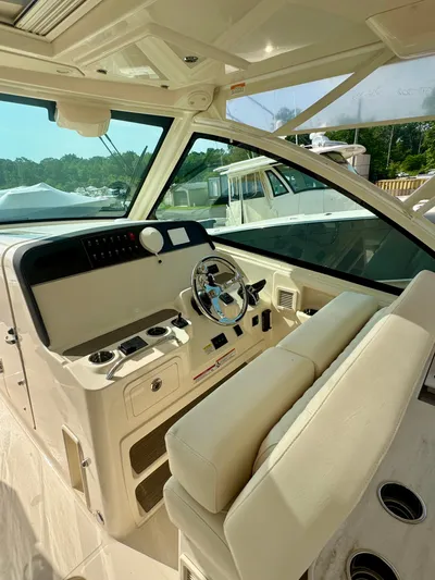  Yacht Photos Pics 2025 Grady-White Freedom 375 boat interior with steering wheel and control panel.