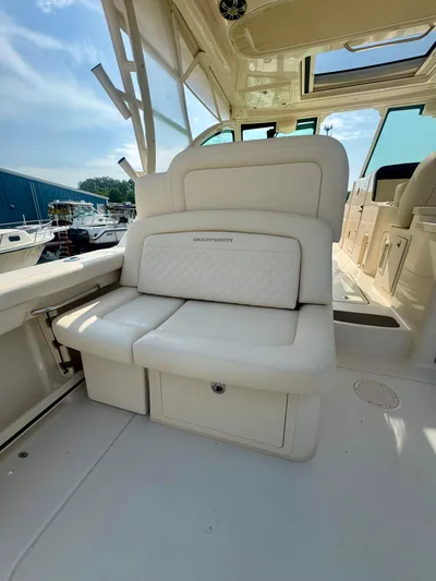  Yacht Photos Pics 2025 Grady-White Freedom 375 boat interior with white seating and storage compartment.