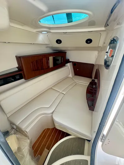  Yacht Photos Pics 2025 Grady-White Freedom 375 cabin interior with white seating and wood accents.