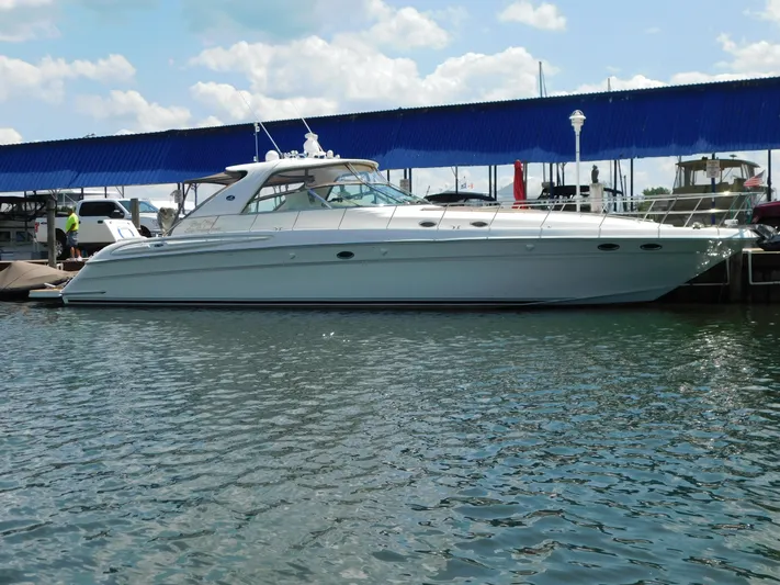  Yacht Photos Pics 2004 Sea Ray 600 Sun Sport yacht docked at marina under blue sky.