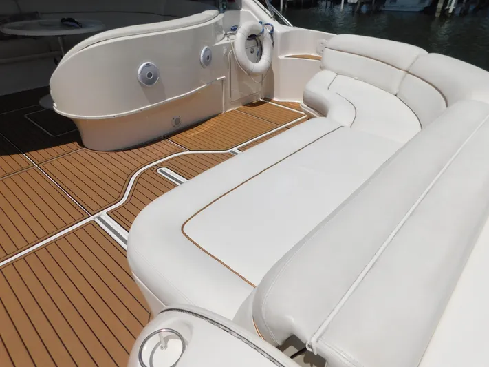  Yacht Photos Pics Luxurious 2004 Sea Ray 600 Sun Sport yacht interior with white seating and teak flooring.