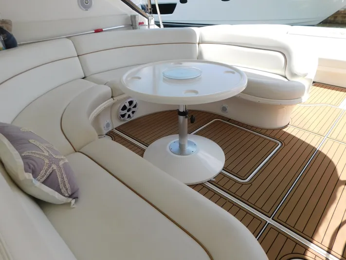  Yacht Photos Pics Luxurious seating area on 2004 Sea Ray 600 Sun Sport yacht with elegant wood flooring.