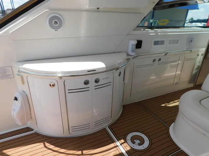  Yacht Photos Pics Interior of 2004 Sea Ray 600 Sun Sport yacht with sleek cabinetry and wood flooring.