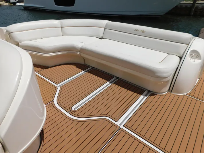  Yacht Photos Pics Luxurious seating on 2004 Sea Ray 600 Sun Sport yacht with teak-style flooring.